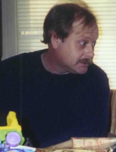 My dad, making a face at Aidyn.