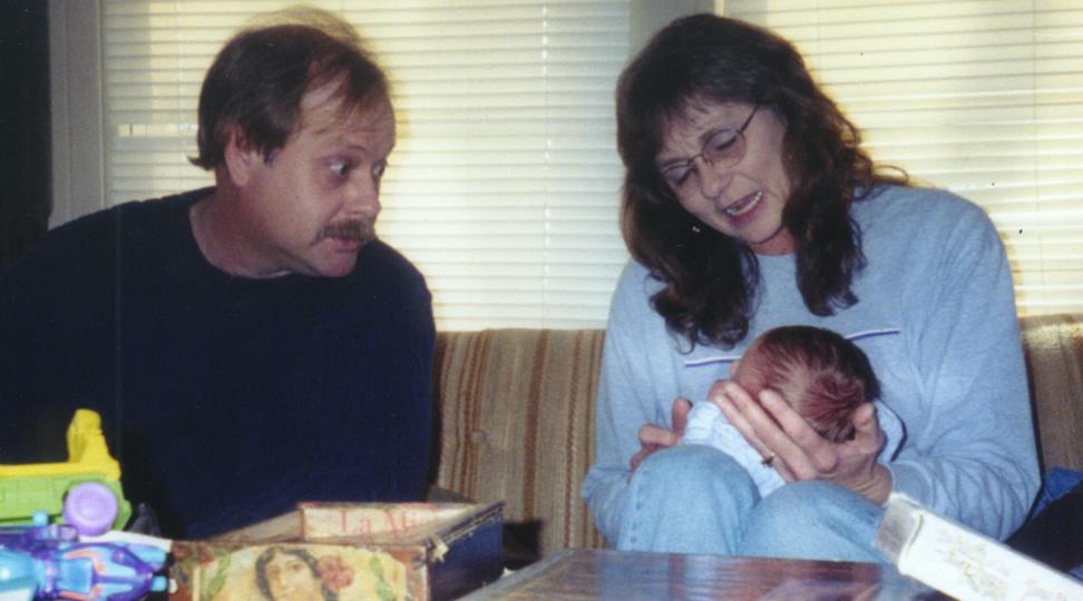 Dad and Debbie, who is holding Aidyn.
