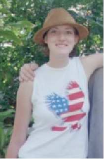 Kerrie posing, wearing some freaky hat. =P