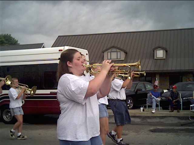 Bellinda playing her trumpet in a parade.