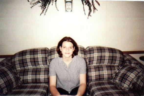 Jess sitting on her couch.