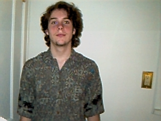 I love this picture. He looks hot, even if he doesn't think he is.