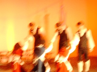 The dance finishes in a whirl of colours