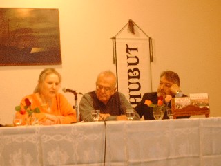 The panel, with Gareth Miles, translator into Welsh (centre) and Carlos Dante Ferrari, the original author (right) 