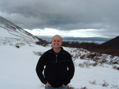 Me standing on the Glacier, with storm clouds circling