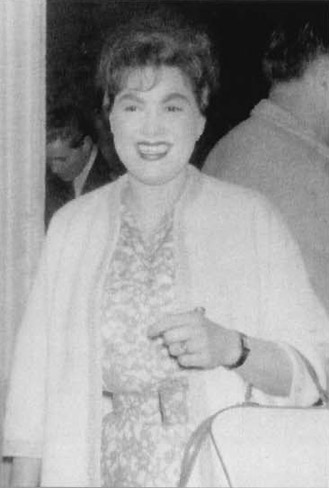 Patsy backstage wearing green lace dress