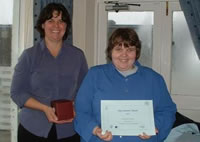IDEA member receiving her award.