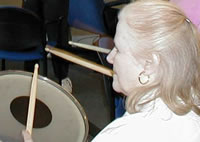 IDEAs member playing a drum.