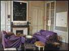 A formal living room in gray... and purple... and leopard skin