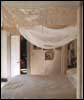 An ethereal bedroom hung with antique lace