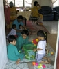Toys!  Gimme, gimme, gimme!  Your toys are mine now!!!  Ayah Ngah looks on in the background