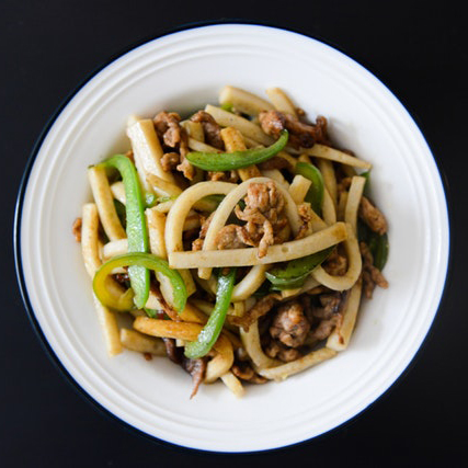 noodle dish in a white bowl