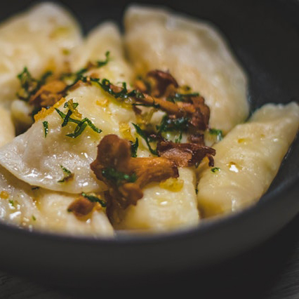 dumpling dish in a black bowl
