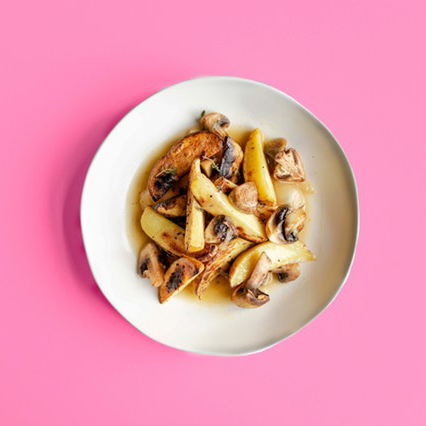 asian dish in a white bowl on a pink background