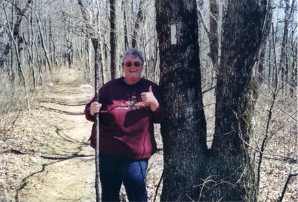 Mom pointing to an Appalachian Trail marker