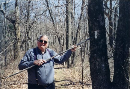 Dad pointing to an Appalachian Trail marker