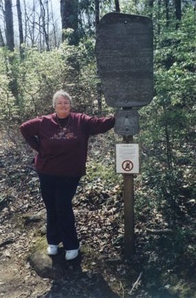 Mom pointing to an Appalachian Trail marker