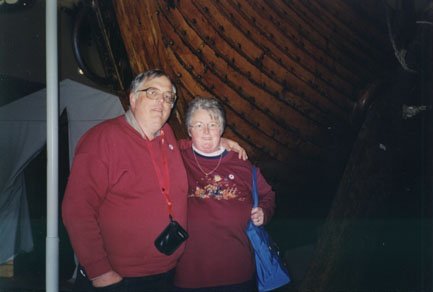 Dad and Mom in front of the boat