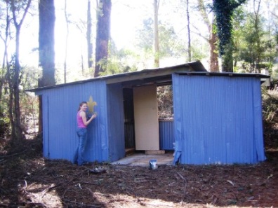 A Sir Dallas Brook Rover painting the toilets