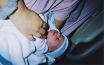 A close up of Adrienne holding AJ