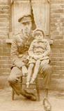 Unknown soldier with child, NE London about 1916.
