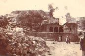 Village building, cows and people, India 1915