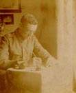 Soldier writing with inkwell,1915.