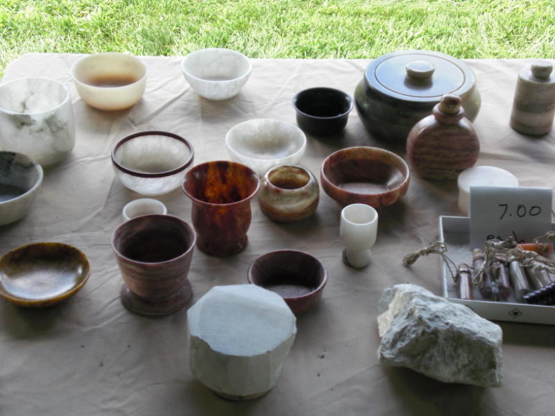 rough_stone_bowl_in_front_of_finished_pieces