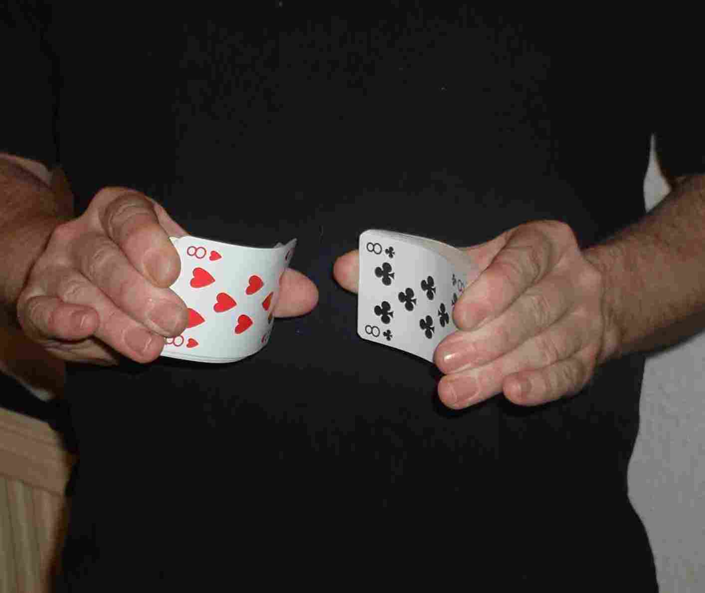 Bend both halves of the pack of cards back and forward.
