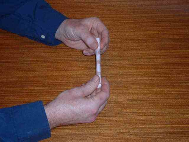 Roll cigarette tightly in a dollar note.