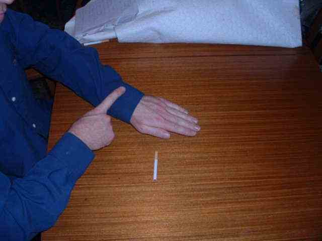 Pub trick where you appear to charge your finger with electricuty on your sleeve.