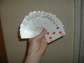 Card fan demonstating card sleight techniques by magician.