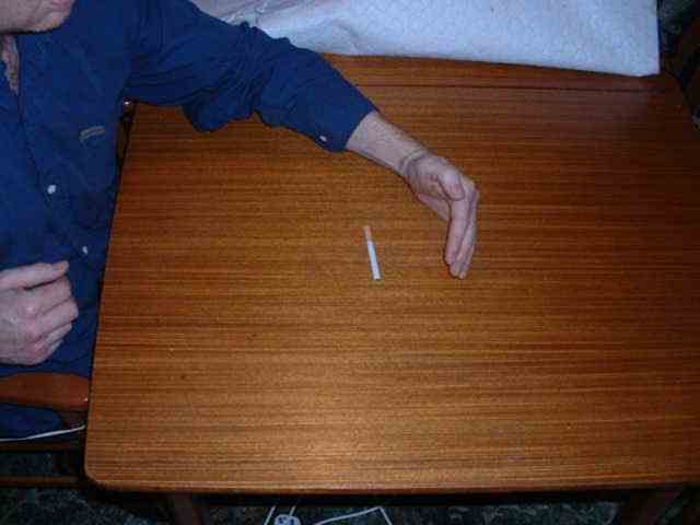 Pub trick where your hand magically appears to draw the gigarette back.