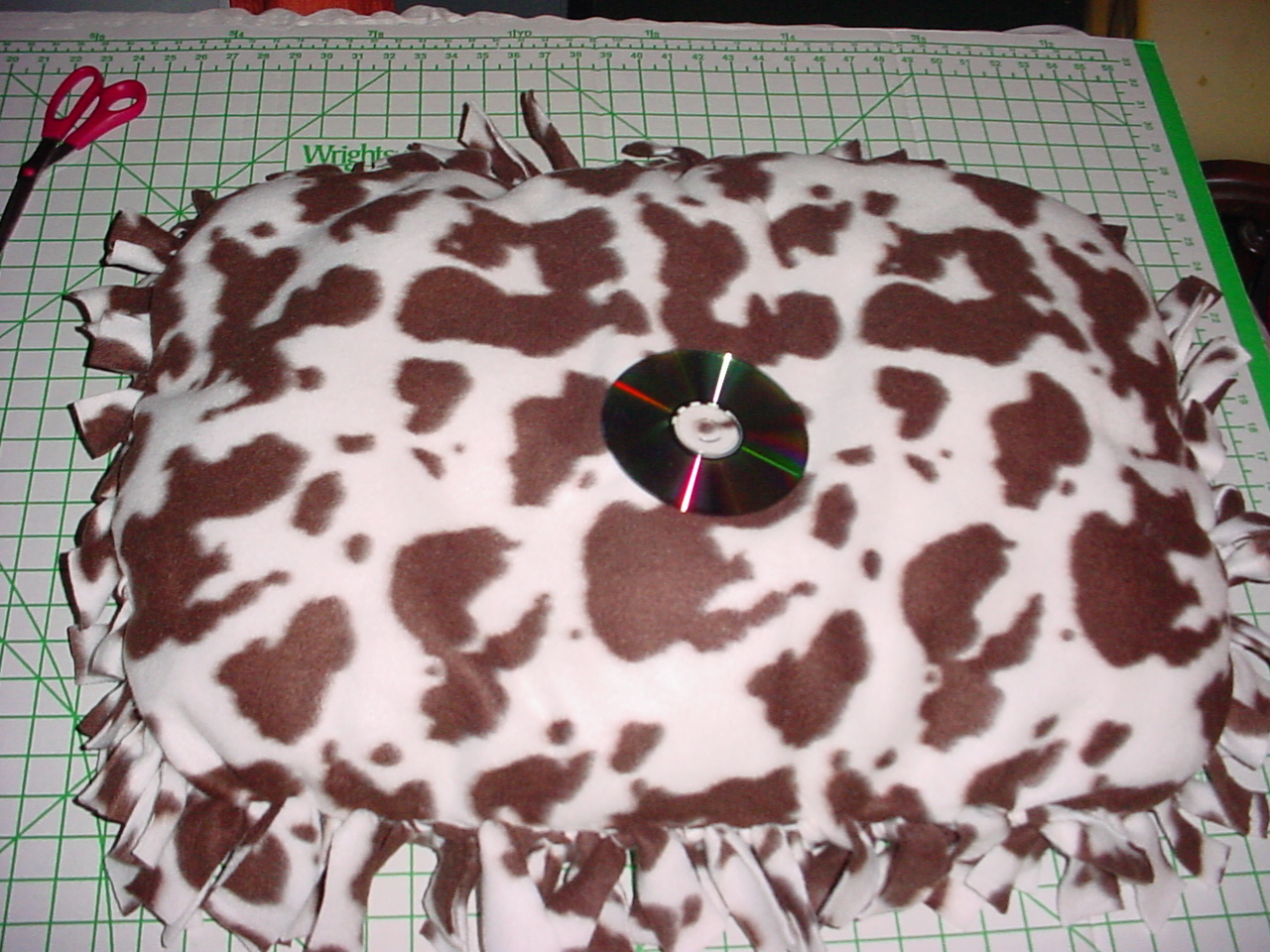 Medium size bed with a CD on it for size reference.