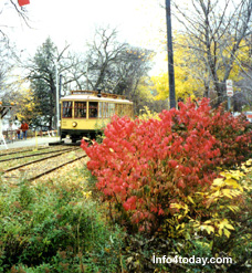 The Lake Harriet Streetcar Line is operated by the Minnesota Transportation Museum, an affiliate of the Minnesota Historical Society. The date is late October, 2004, and the leaves of many trees and shrubs have turned to golds and reds.