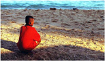 Junge am Strand.