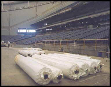 Rolls of astroturf in front of future hometeam dugout