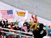 Dale Jr. waves to the fans during a pre-race parade lap in a hummer (sorry about the pole).