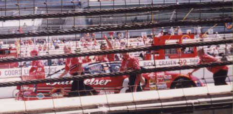 Tony Eury, Jr. and the Bud gang push the #8 Chevy to the starting grid