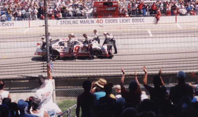 The Goodwrench crew pushes Harvick's 29 car to the line to a round of applause from the crowd.