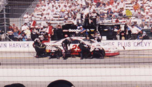 The crew goes to work changing right-side tires.