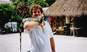 Me holding a common green iguana, in Playa del Carmen, Mexico.