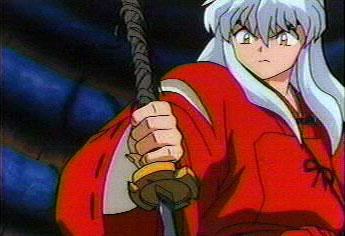 Inuyasha about to pull out Tetsusaiga