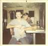 Joe Tucker, James Tyer and Joe Gross in mess hall during refueling at sea