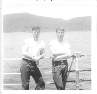 Joe Tucker and Joe Gross with coast of Viet Nam in background