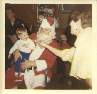Frank DeMoss playing Santa Clause with Rob Tucker in his lap and Dot on right
