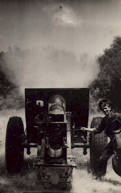 A Howitzer firing.  Notice the projectile in the top center.