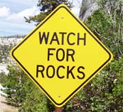 watch for rocks road sign