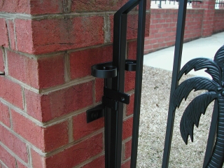 Detail of gate latch mechanism with scroll handle