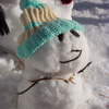 One small snowman the kids built in a snowman family.
